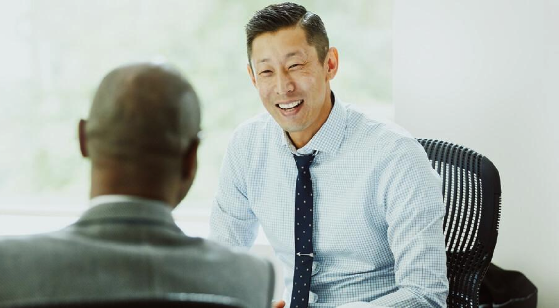 Two men in suits having a discussion 