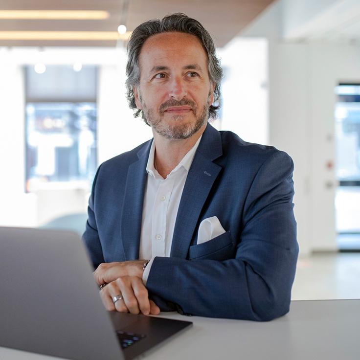 image of man at desk with laptop