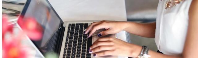 woman typing on laptop