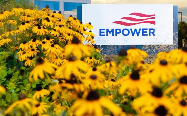 View of Personal Asset headquarters in Colorado, yellow flowers next to sign