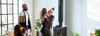 a family stands in living room